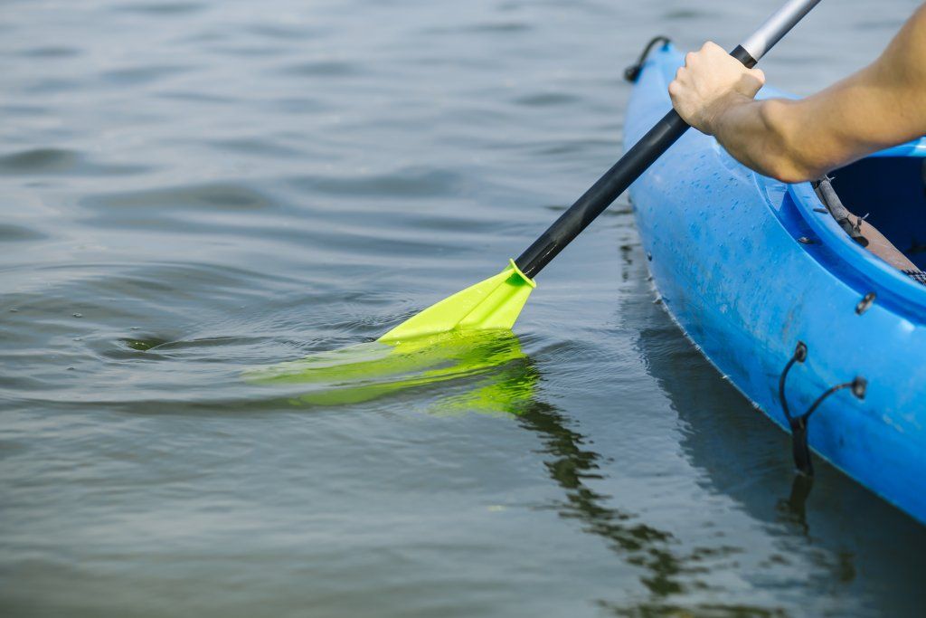 man-paddling-kayak-lake.jpg