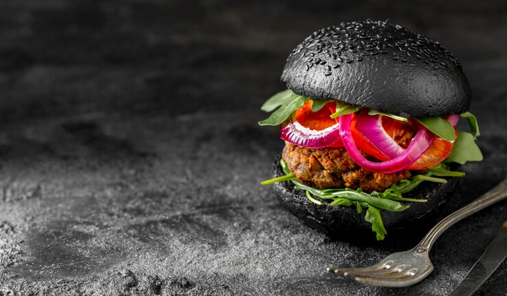 front-view-veggie-burger-with-black-buns-cutting-board-with-copy-space_23-2148784541.jpg