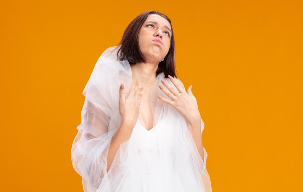 young-bride-beautiful-wedding-dress-rolling-eyes-up-annoyed-bored-standing-orange_141793-128973.jpg