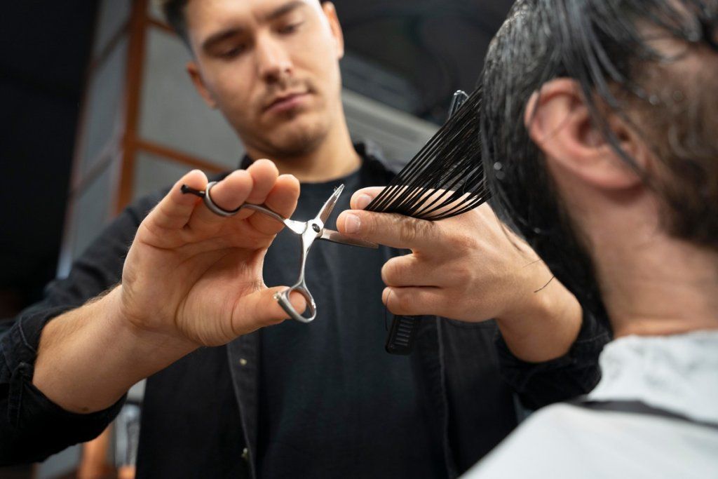 close-up-hairdresser-using-scissors.jpg